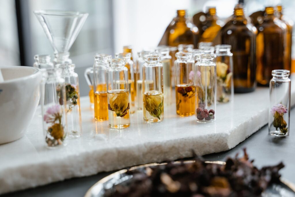 Clear Glass Bottles on White Surface